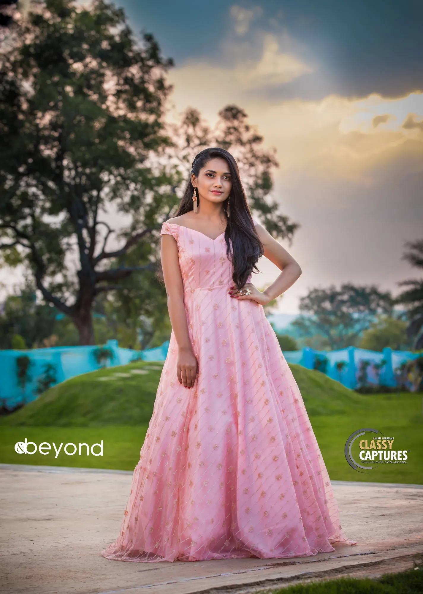 Blush pink gown in garden at golden hour