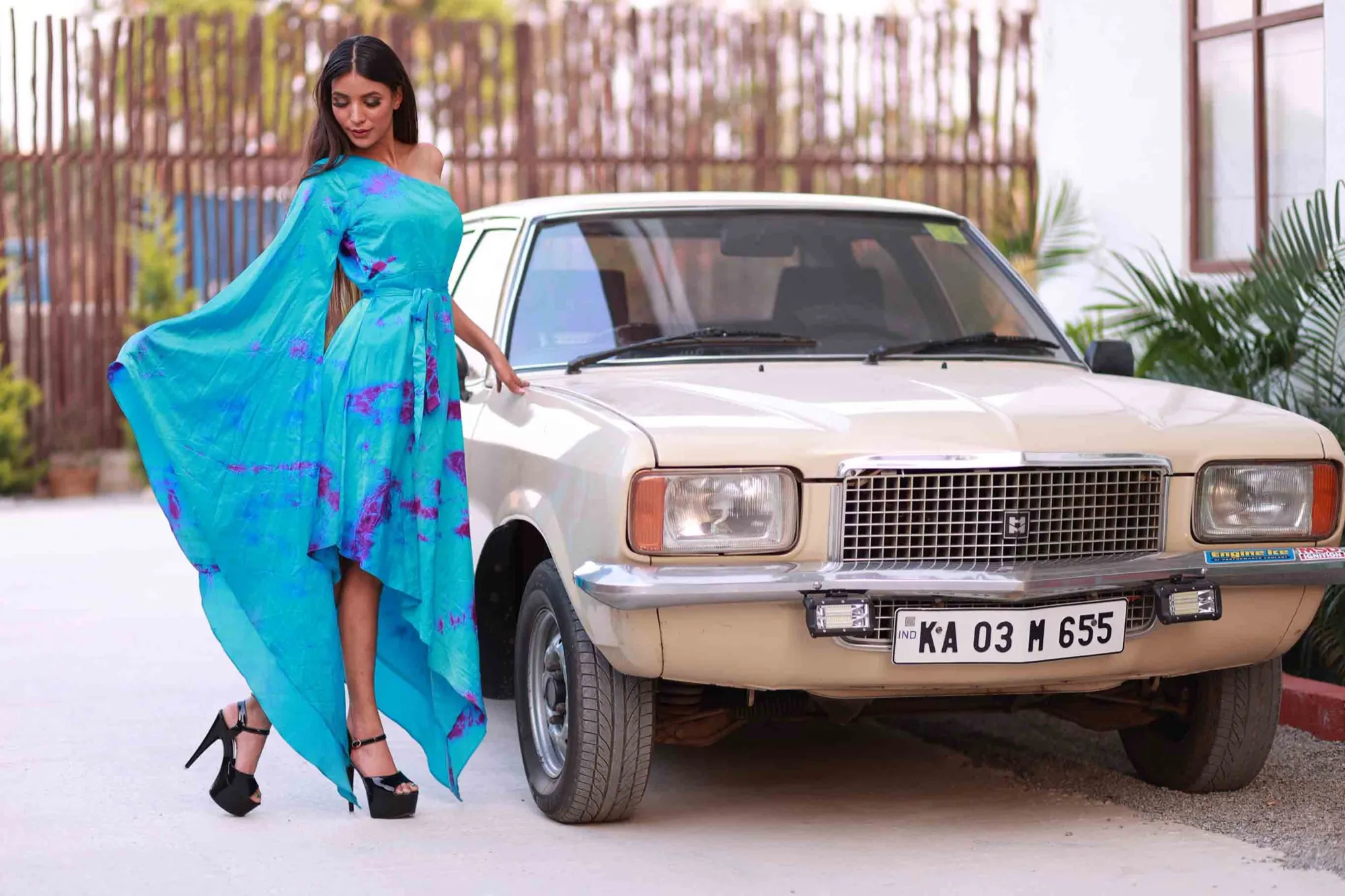 Turquoise tie-dye gown with vintage car